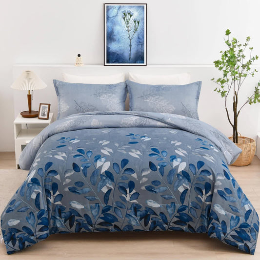Blue botanical duvet cover and pillowcases set on bedroom bed