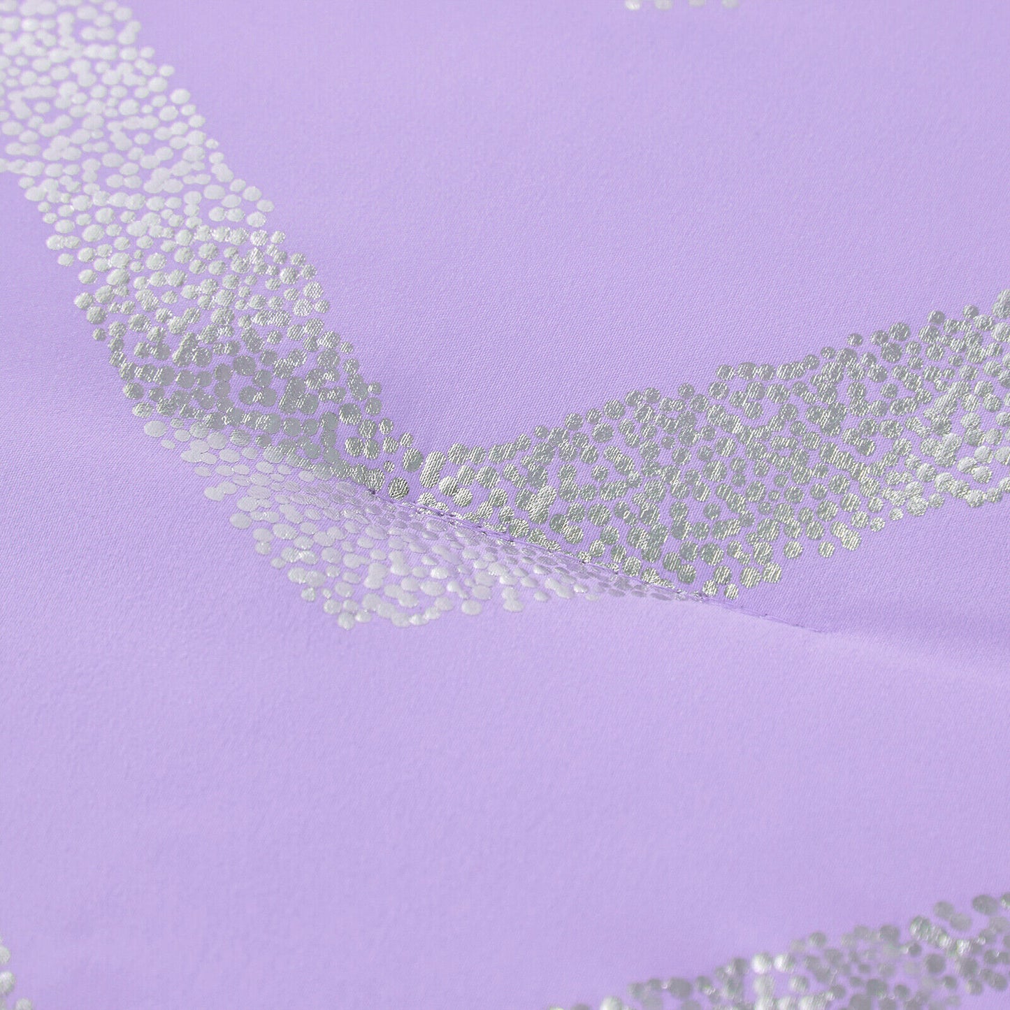 Lavender fabric close-up with silver sequin zigzag accents