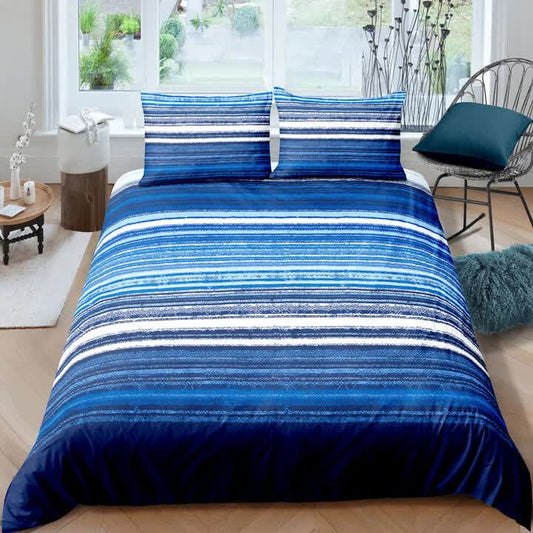 Blue striped comforter set with matching pillow shams, layered on a bed