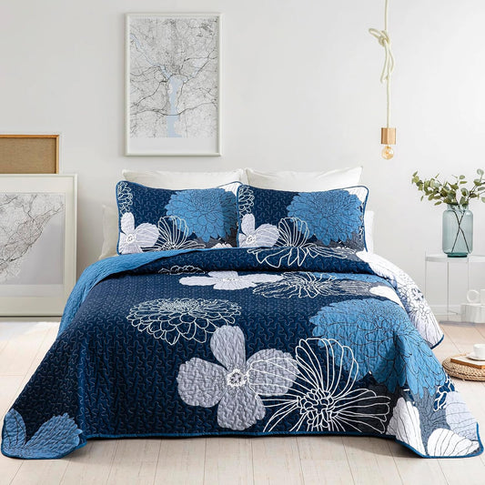 Blue king comforter set with two floral pillow covers, dark blue base and white blooms