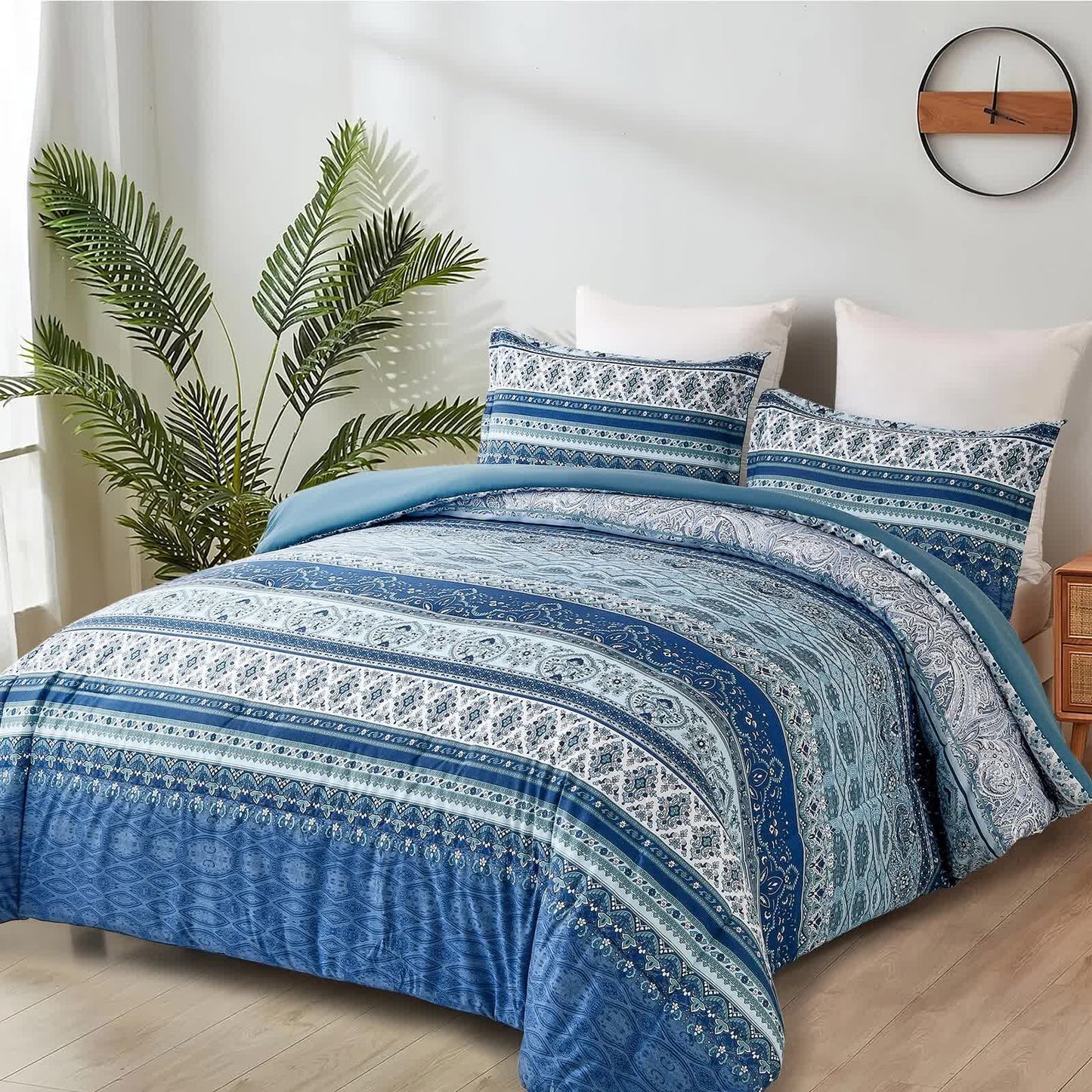 Blue boho bedding set on bed with patterned comforter and two matching pillow covers