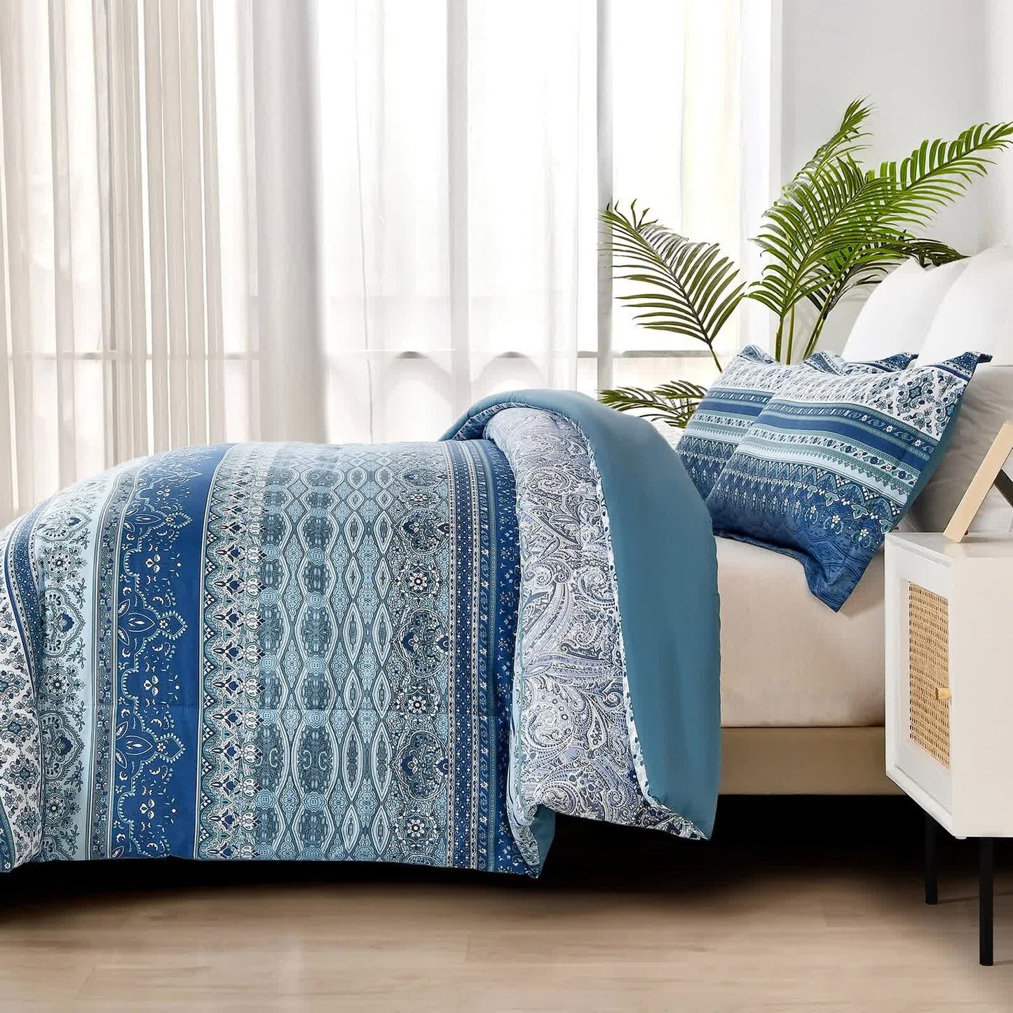 Blue patterned comforter with coordinating pillow covers in boho stripe medallion design
