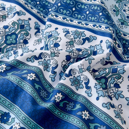 Close-up of blue and white boho medallion and paisley fabric pattern