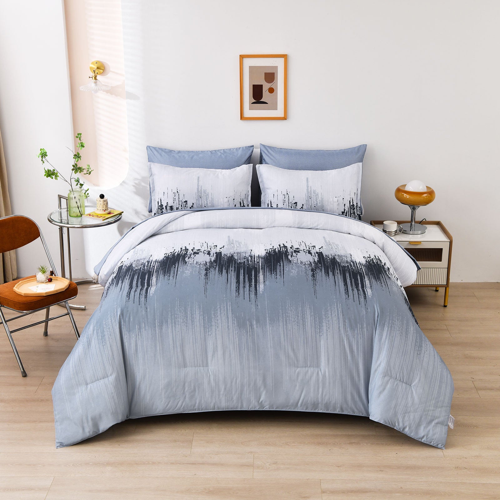 King comforter set with light blue comforter and white/black brush-pattern pillows