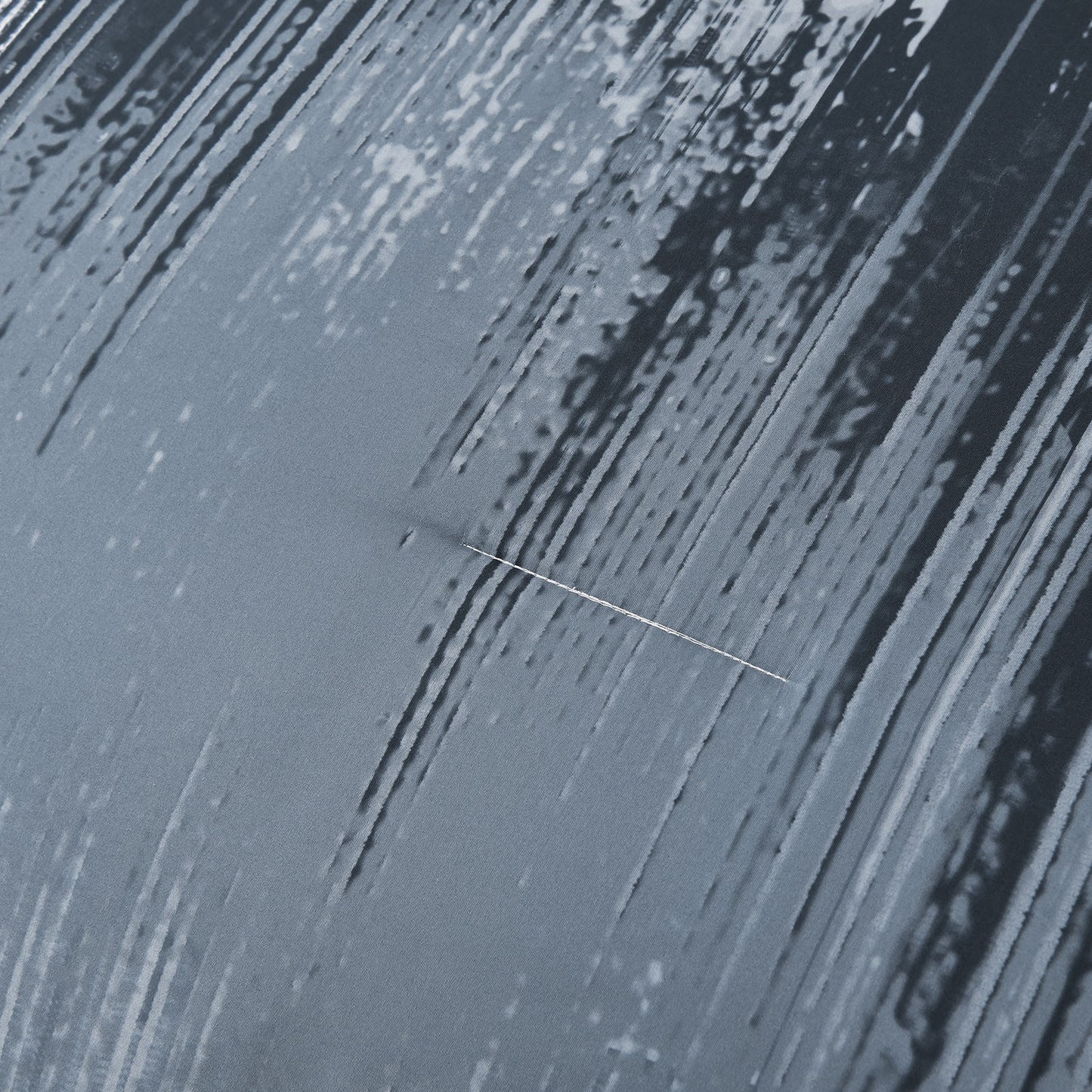 Light blue comforter panel with vertical white streaks and black splatter pattern