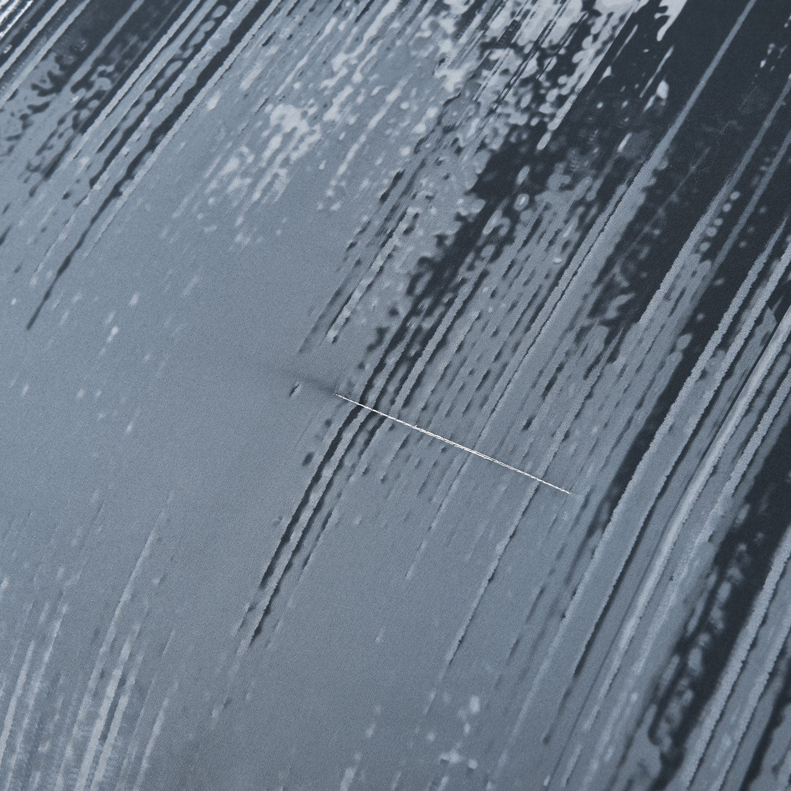 Light blue comforter panel with vertical white streaks and black splatter pattern
