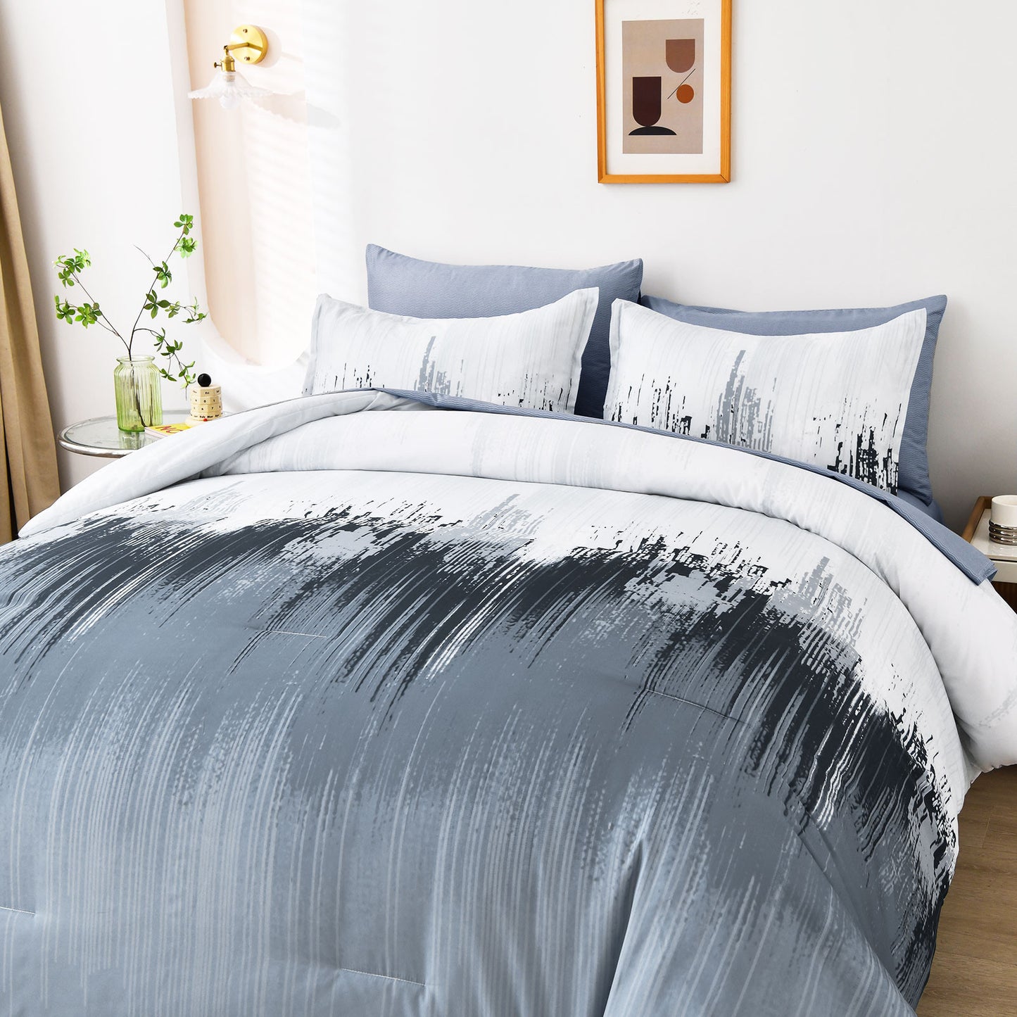 Light blue king comforter with white and black abstract stripe pattern and two pillowcases