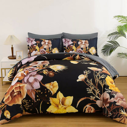Quilted bedding set with black floral comforter, gray accents, and two patterned pillows