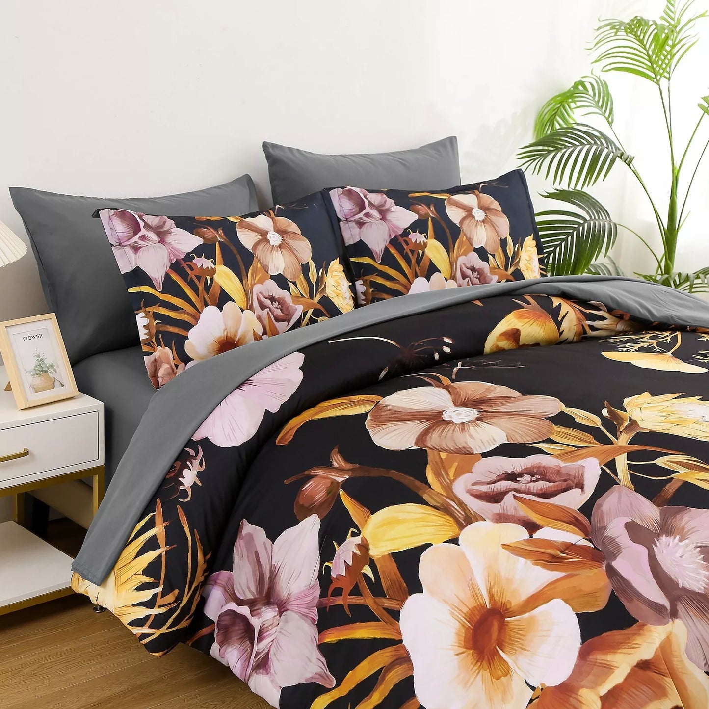 Quilted comforter set with black floral print and gray solid pillowcases