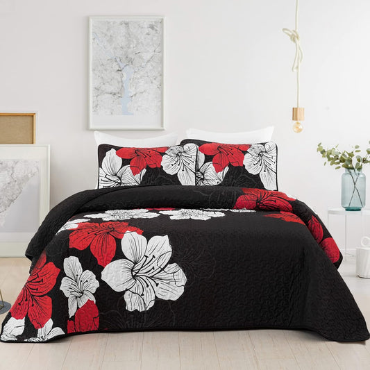 Quilted coverlet and pillow shams set in black with red and white floral pattern