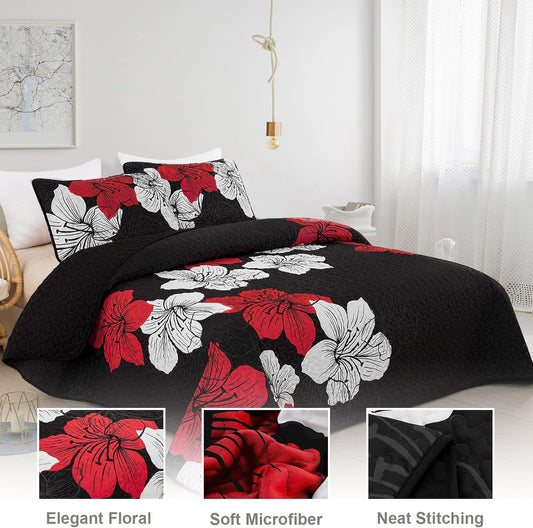 Quilted coverlet and pillow shams set with black base and red/white floral pillows