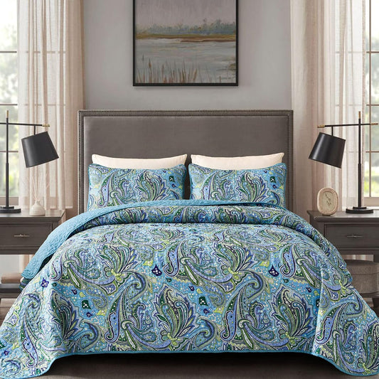 Quilt coverlet set with blue-green paisley pattern and matching pillow shams