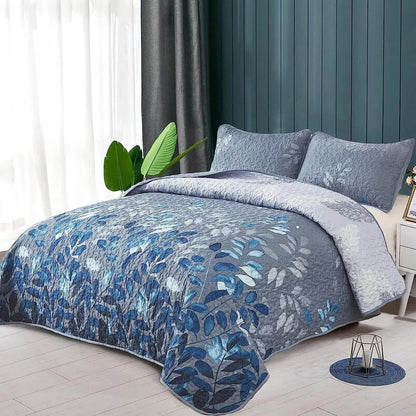 Blue botanical quilted coverlet with two matching pillow shams, quilted leaf pattern