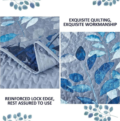 Quilted blue botanical fabric with leaf pattern, coverlet corner fold detail