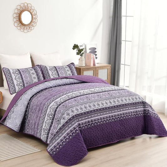 Purple and grey paisley stripe bedspread with matching pillowcases on the bed