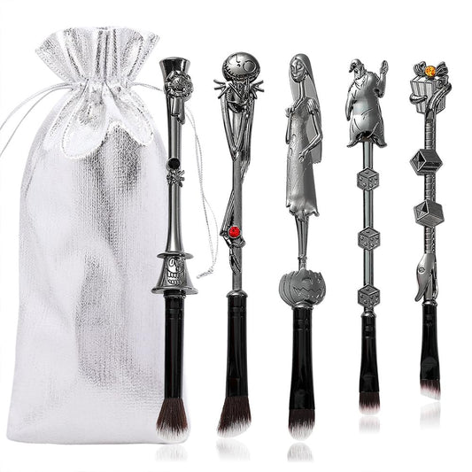 Skeleton makeup brush set with five metal brushes and pouch, black bristles