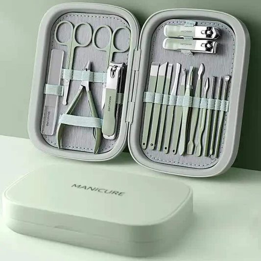 Stainless steel nail care tools in compact manicure kit case, open with clipper and files