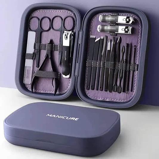 Manicure tools set in open compact case with stainless steel clippers and purple lining