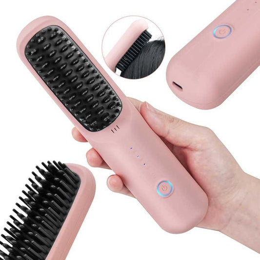 Rose pink hair straightening brush held in hand with bristle head