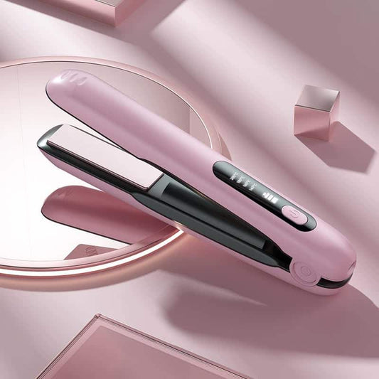 Pink cordless hair straightener with black plates and power button