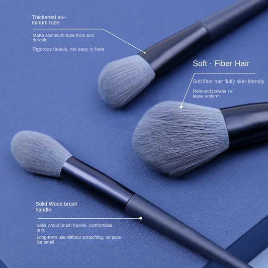 Makeup brush set close-up: soft synthetic heads with dark handles and metal ferrules