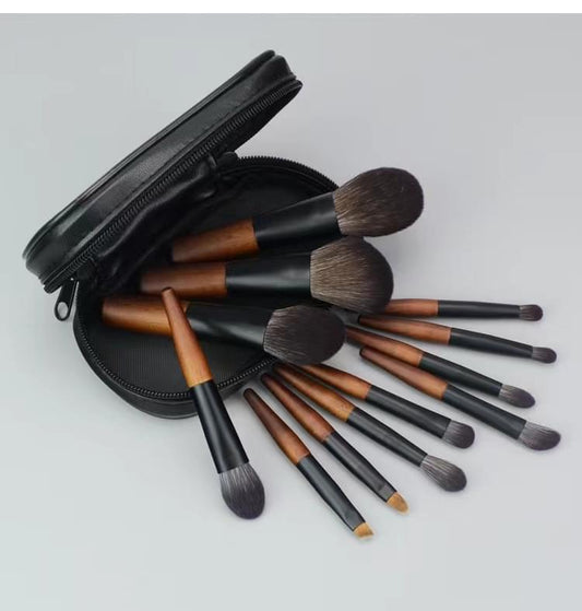 12-piece mini makeup brush set with fiber bristles, black zip bag, brown handle ferrules