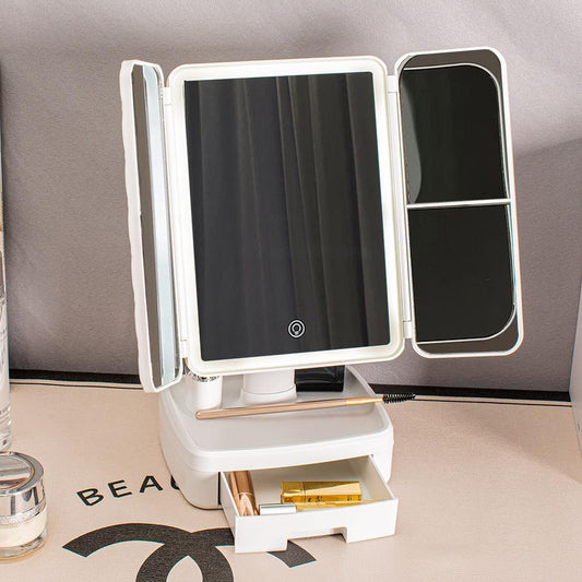 Tri-fold LED vanity mirror with dark central glass panel and side doors, white frame