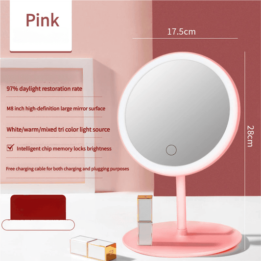 Pink round LED makeup mirror on tabletop stand with illuminated outer light ring