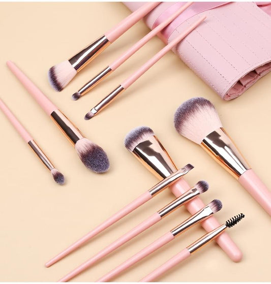 Pink makeup brushes with metallic ferrules and soft bristles, with travel case