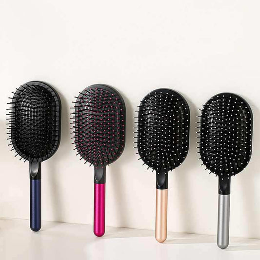 Set of air-cushion hair brushes with black pads and four handle colors