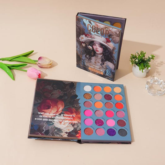 Eyeshadow palette book with multicolor round pans, open to show matte and shimmer shades