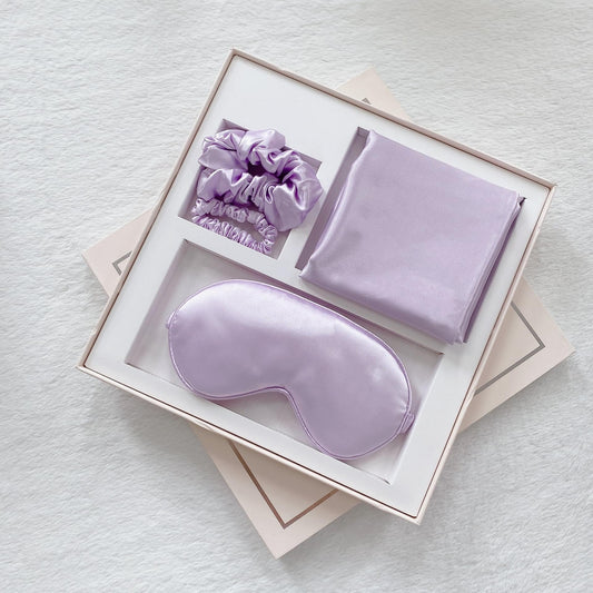 Violet satin sleep mask set with pillowcase and hair accessories, boxed