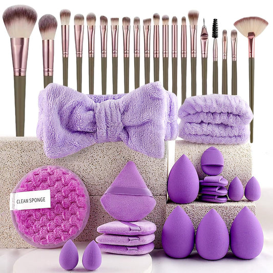 Purple beauty tool kit with makeup brushes, sponges, and pouch