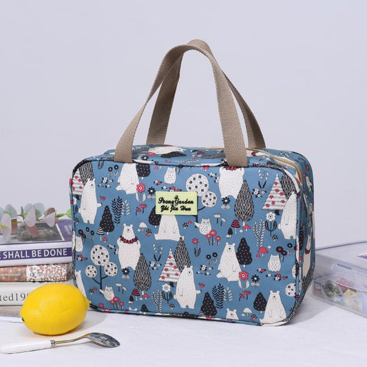 Light blue patterned handled travel bag with zip top and printed logo patch