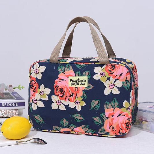 Navy floral zippered handled toiletry bag with beige top handles