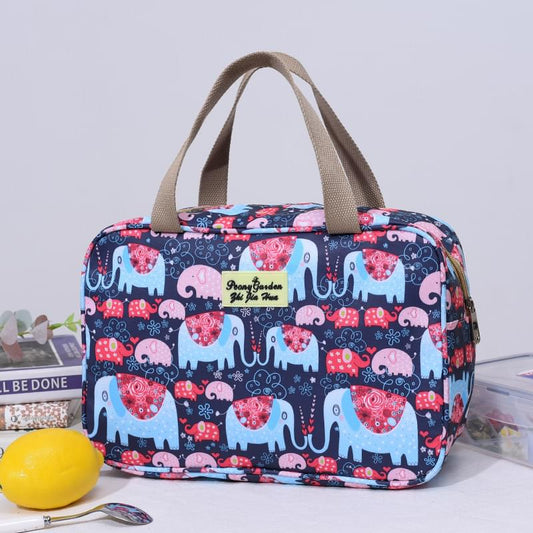 Navy elephant-print handled travel bag with zip top and beige fabric handles