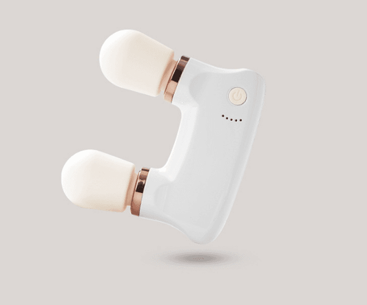 Dual-head mini massager with white body and rounded rollers, rose-gold trim