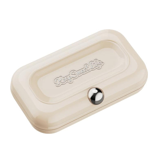 Beige manicure kit case with round silver latch and embossed logo