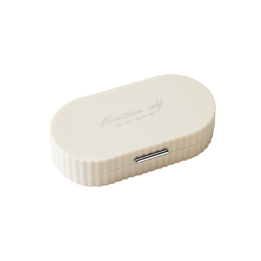 Beige compact manicure case with oval shape and metal latch