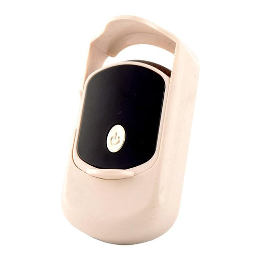 Beige heated eyelash curler with black display panel and power button
