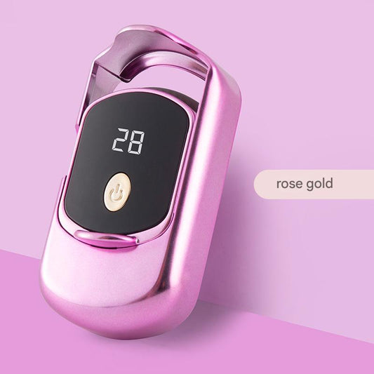 Rose gold heated eyelash curler with LED temperature display showing 28