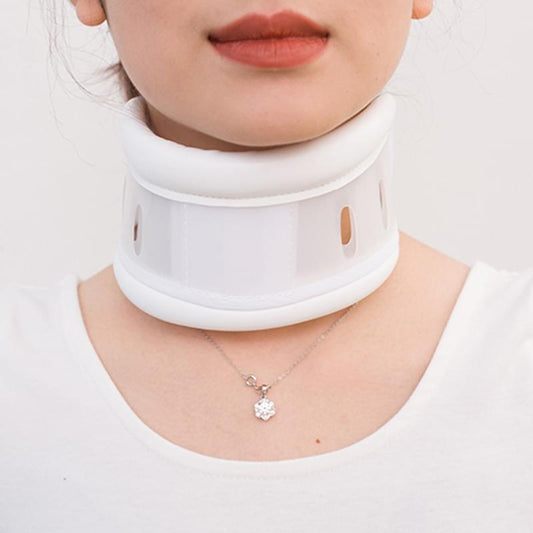 White adjustable cervical collar centered around the neck with vent holes