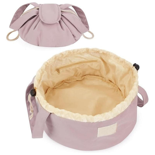 Drawstring makeup bag in lilac with wide opening and light ruffled lining