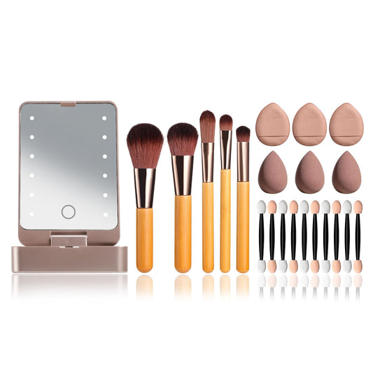 Portable makeup brush kit with LED mirror case, pink sponges, and applicators