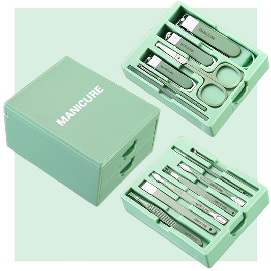 Green manicure grooming kit case with metal tools in drawers