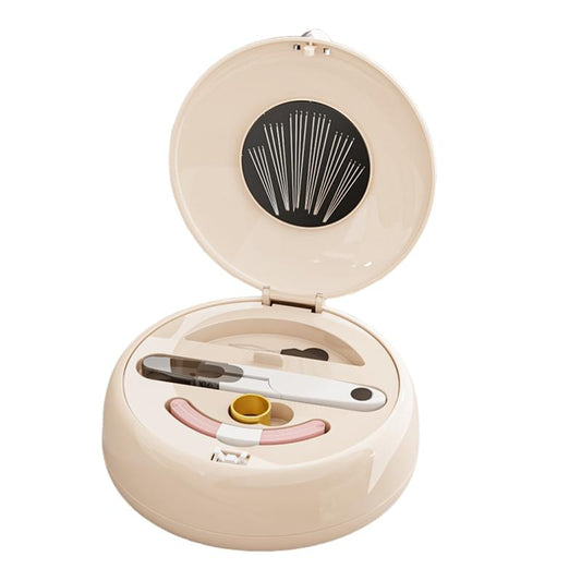 Beige round compact sewing kit organizer with lid open and magnetic needle pin tray