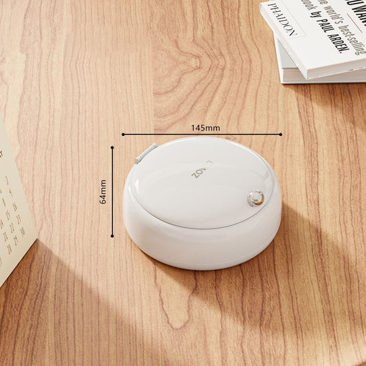White round sewing kit organizer with magnetic needle case, lid closed.