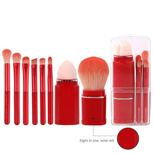 Retractable makeup brush set with red handles and compact travel case