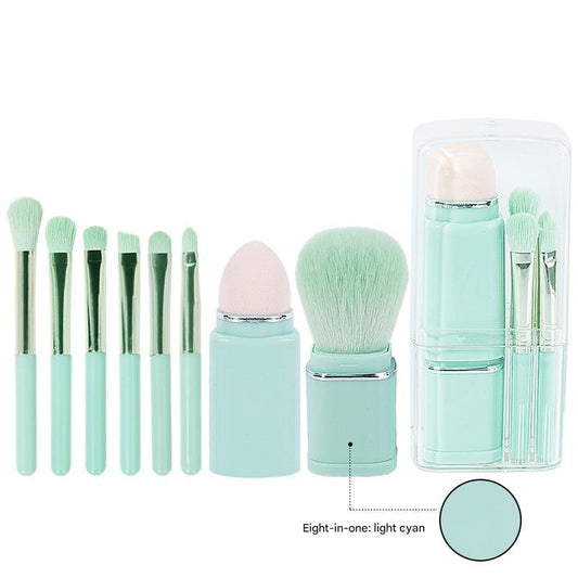 Light cyan makeup brush set with clear compact case and retractable brushes
