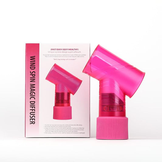 Pink hair dryer diffuser attachment with ribbed grip and T-shaped nozzle.